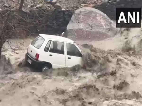 Car damaged due to floods and landslide in Kullu (Photo: ANI)