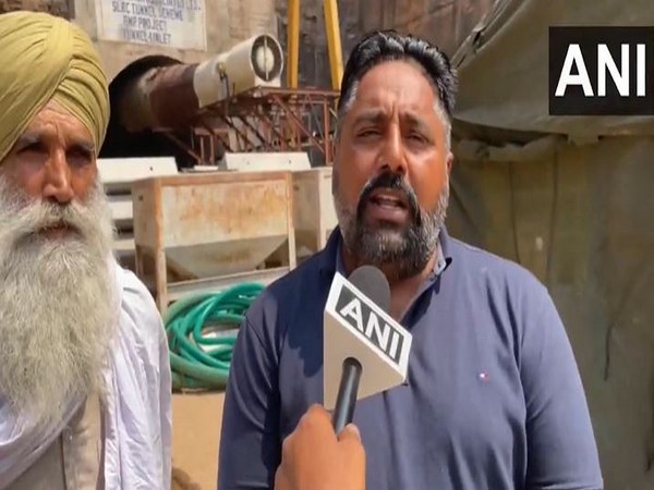 Family members of Gurpreet Singh, one of the eight workers trapped inside tunnel (Photo/ANI)