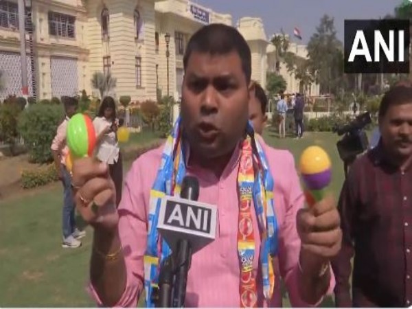 RJD MLA Mukesh Raushan staging a protest on Tuesday. (Photo/ANI)