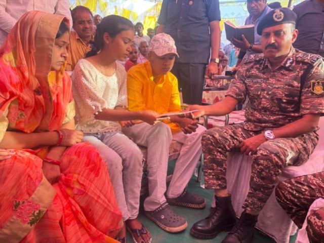 CRPF DG meets family of slain Head Constable Mahima Nand Shukla (Photo/ANI)