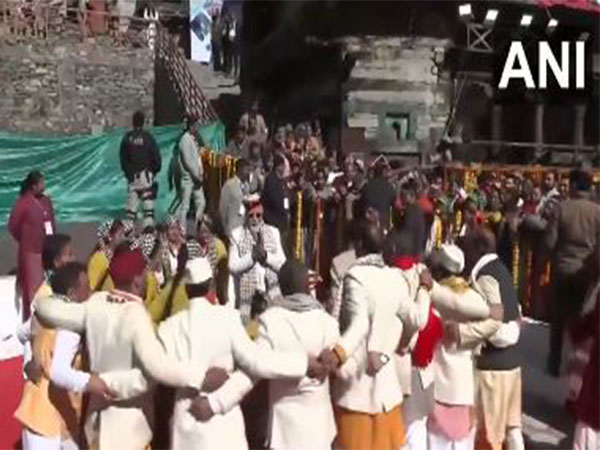 PM Modi interacts with local artists during a folk dance performance in Mukhwa.(Photo/ANI)