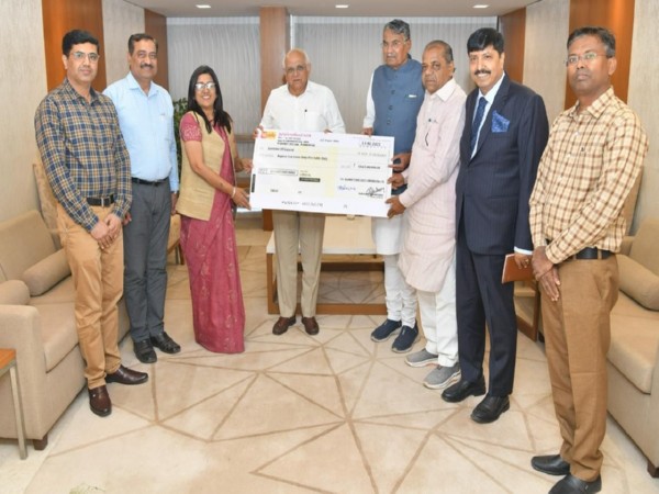 Gujarat Chief Minister Bhupendra Patel receives Rs10.65 crore dividend cheque. (Photo/ANI)