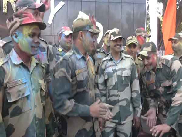BSF troops celebrating Holi near the International Border in the RS Pura sector of Jammu on Thursday. (Photo/ANI)