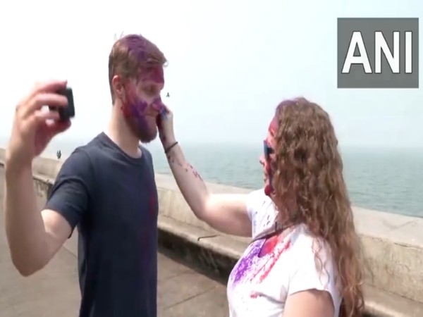 Foreign tourists celebrate Holi with locals in India (Photo: ANI)