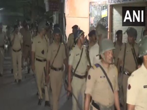 Maharashtra Police and security personnel conduct a flag march in the violence-hit area of Nagpur (Photo/ANI)