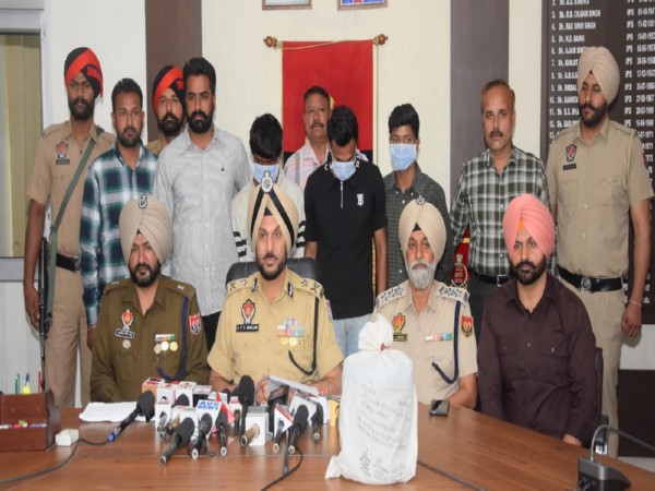 Punjab police personnel with the accused arrested (Photo/Information and Public Relations Department, Punjab )