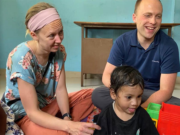 American couple with the tribal boy (Photo/ANI) 