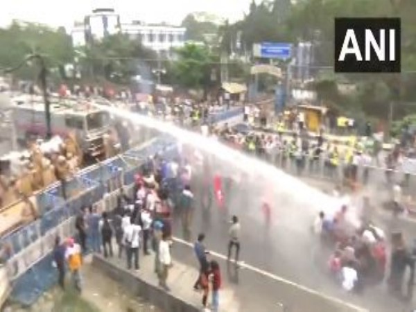 Police use water cannons to disperse the crowd in Siliguri. (Photo/ANI)