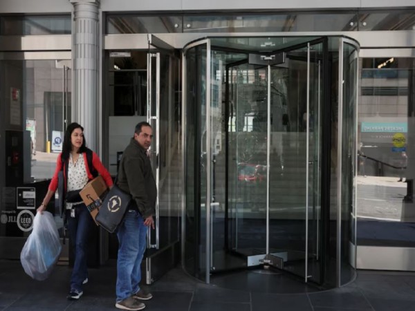 Employees of the US Agency for International Development (USAID) depart after being told they could go home, in Washington DC (Image/Reuters)