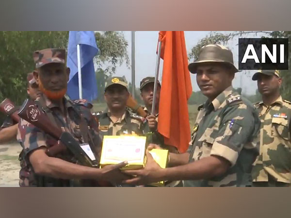 BSF, BGB exchange sweets at India-Bangladesh Border on Eid-Al-Fitr near Jalpaiguri. (Photo/ANI)