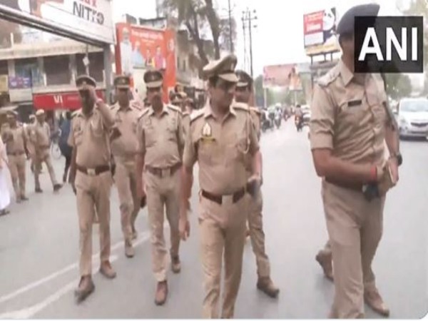 Uttar Pradesh Police carry out flag march in Varanasi (Photo/ANI)