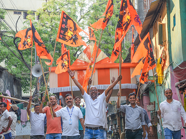 Devotees take out a religious procession holding Lord Hanuman's flags on the eve of Rama Navami, in Howrah on Saturday. (Photo/ANI)