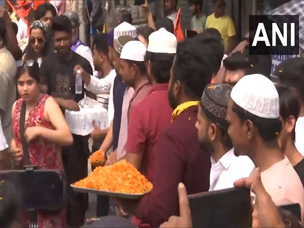 Muslim youths were seen distributing water bottles (Photo/ANI)