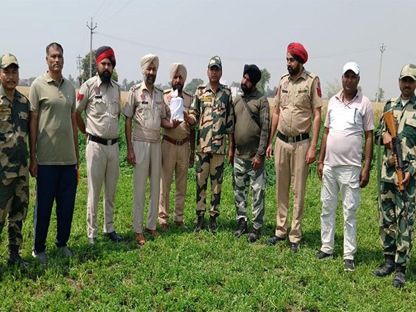 BSF and Punjab police with the suspected heroin. (Photo/ANI) 