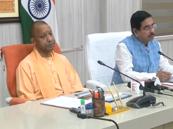 Uttar Pradesh CM Yogi Adityanath and Union Minister Pralhad Joshi (Photo/ANI)