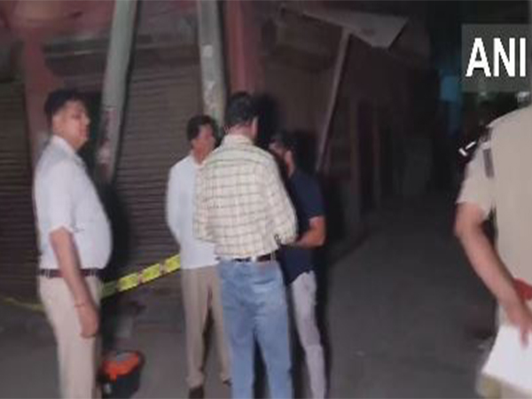 A police team inspects Mustafabad crime scene after a firing incident (Photo/ANI)