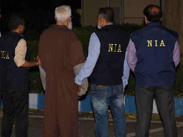 26/11 attacks accused Tahawwur Rana with NIA officials. (Photo/NIA)