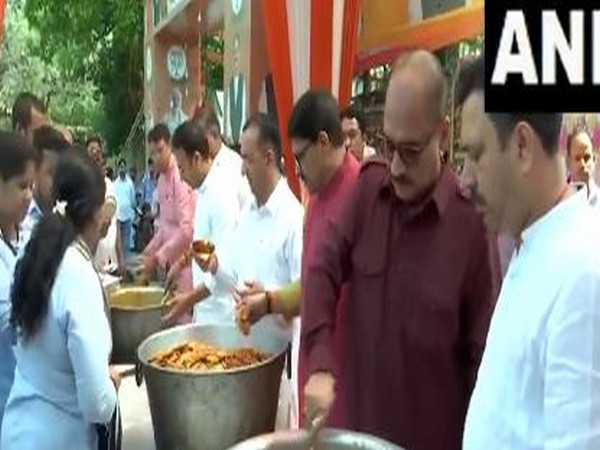 Delhi BJP President Virendra Sachdeva distributes food on occasion of Hanuman Jayanti (Photo/ANI) 