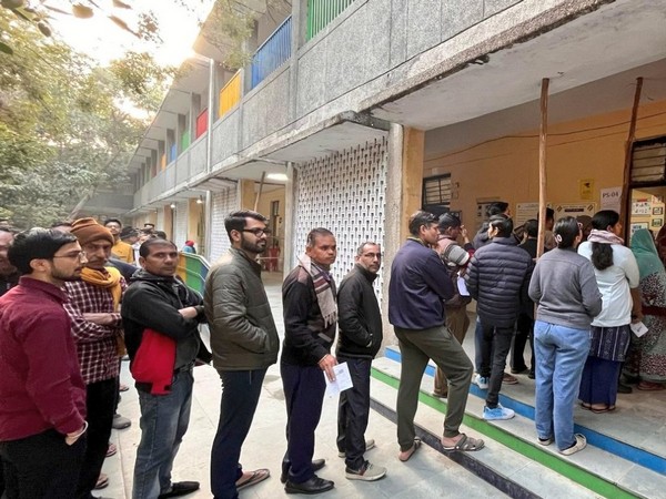 Voters queue at a booth in Delhi (File Photo/@ECISVEEP)