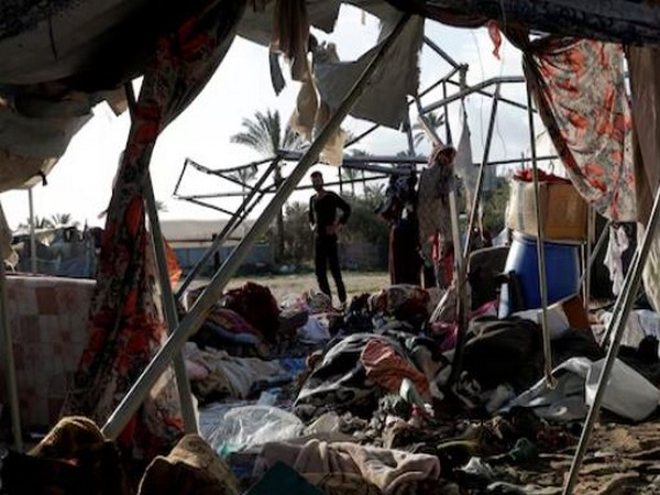 Palestinians inspect the damage at the site of an Israeli strike on a tent sheltering displaced people, in Khan Younis in the southern Gaza Strip (Image/Reuters)