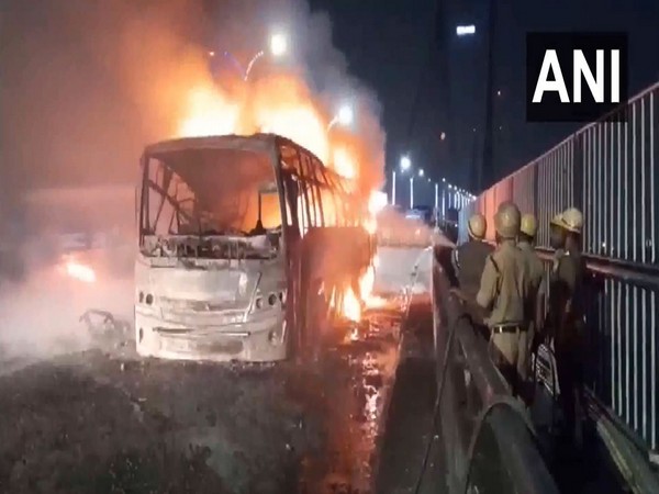 Bus catches fire on Vidyasagar Setu. (Photo/ANI)
