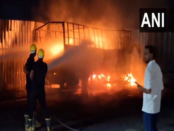 Truck catches fire on NH-48 near Valsad (Photo/ANI)