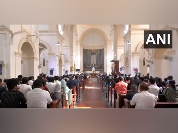 Devotees take part in Good Friday prayers to commemorate the crucifixion of Jesus Christ, at Delhi's Sacred Heart Cathedral (Photo/ANI)