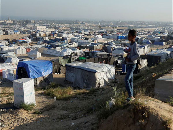 A boy looks on as displaced Palestinians shelter in a tent camp in Khan Younis in the southern Gaza Strip (Image/Reuters)