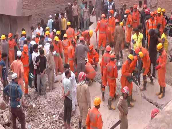 Rescue operation underway after a building collapsed in Delhi's Mustafabad on Saturday morning.(Photo/ANI)
