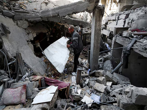A Palestinian man inspects the damage at the site of an Israeli strike on a house, in the northern Gaza Strip (Image/Reuters)