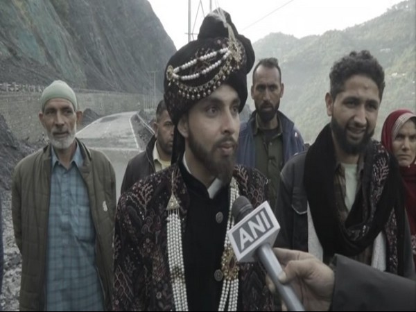The expectant groom, Hashkhor Ahmad, travels on foot due to closure of NH 44 (Photo/ANI)