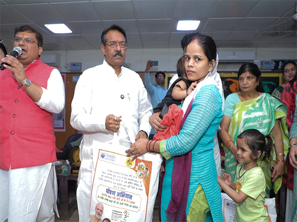 MoS Harsh Malhotra distributing  nutrition kits (Photo/ANI)