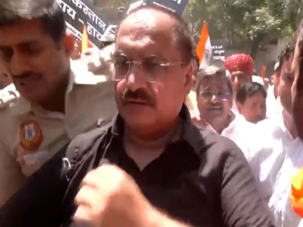 Visuals of Delhi BJP president Virendra Sachdeva being removed from the protest site near Pakistan High Commission (Photo/ANI) 