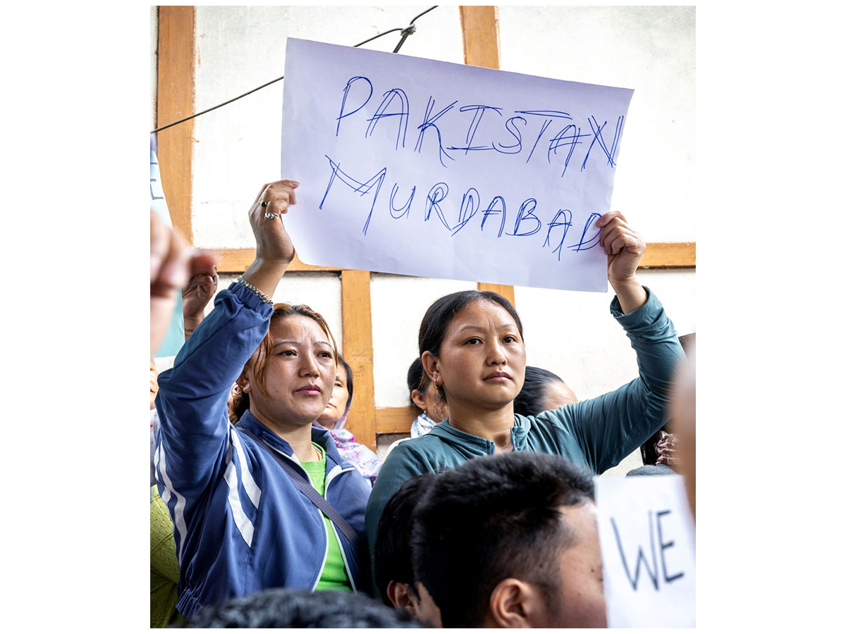 Women hold a placard during a protest outside the residence of Corporal Tage Hailyang against the Pahalgam Terror Attack (Photo/ANI)