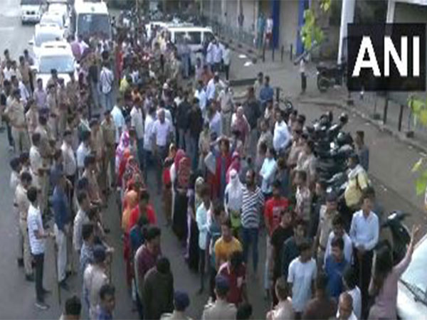 Security officials detain illegal immigrants during a statewide operation in Gujarat (Photo/ANI)