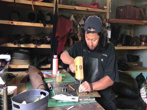 Manipur’s Yaoreishim crafts intricate leather accessories with dreams of global success. (Photo: ANI)