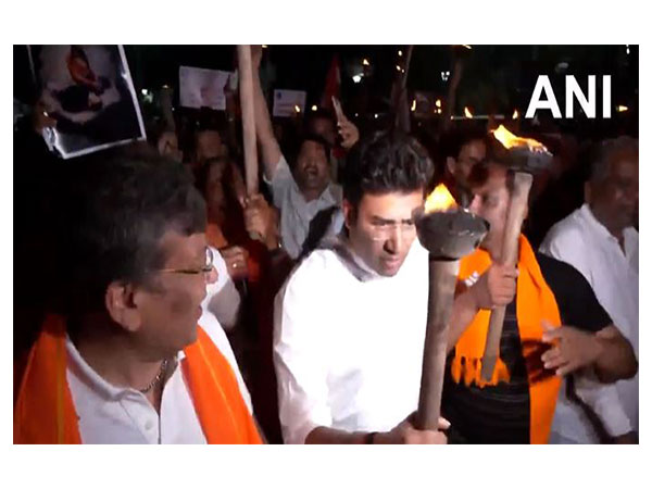 BJP MP Tejasvi Surya takes part in torchlight protest (Photo/ANI)