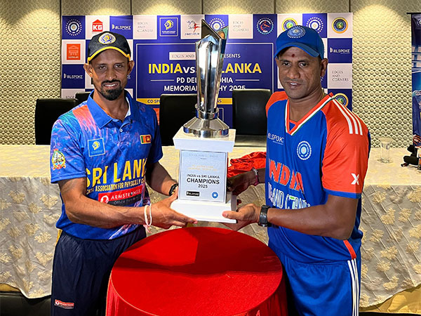 India and Sri Lanka Physical Disability team captains posing with trophy (Image: DCCI)