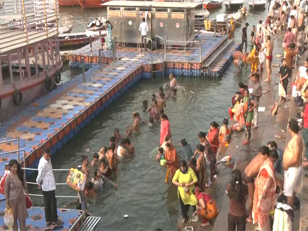 Devotees take a holy dip in river Ganga in Varanasi, Uttar Pradesh (Photo/ ANI) 