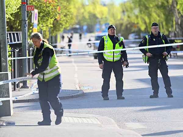 Police officers work on-site a day after shooting in Sweden's Uppsala (Photo Credit: Reuters)