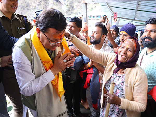 Uttarakhand CM Pushkar Singh Dhami interacting with pilgrims (Photo/ ANI) 