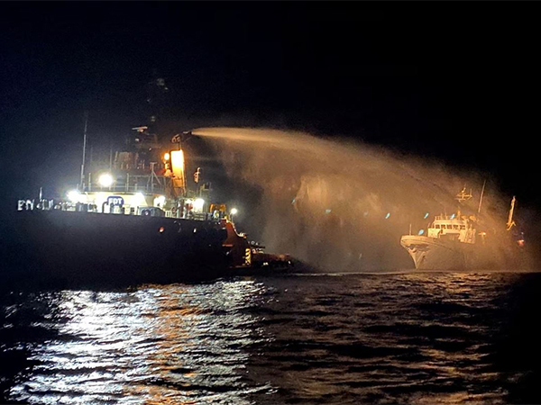 Ship's fire being extinguished (Image/Reuters)