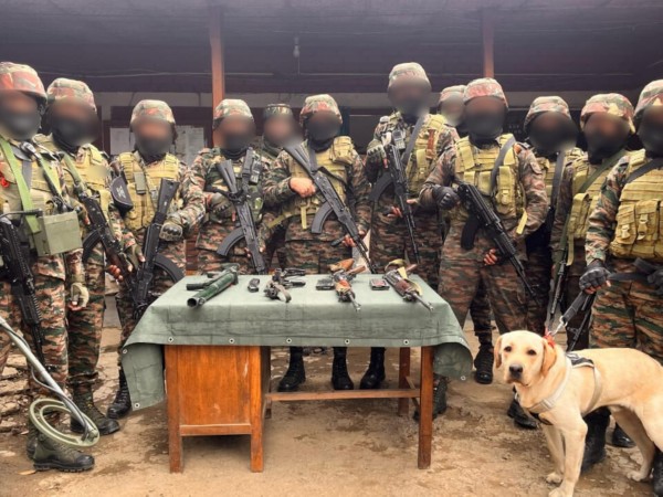 Security forces with recovered arms (Photo/ Assam Rifles) 