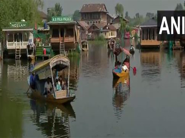 Tourists enjoy Shikara rides at the Dal lake (Photo/ANI)