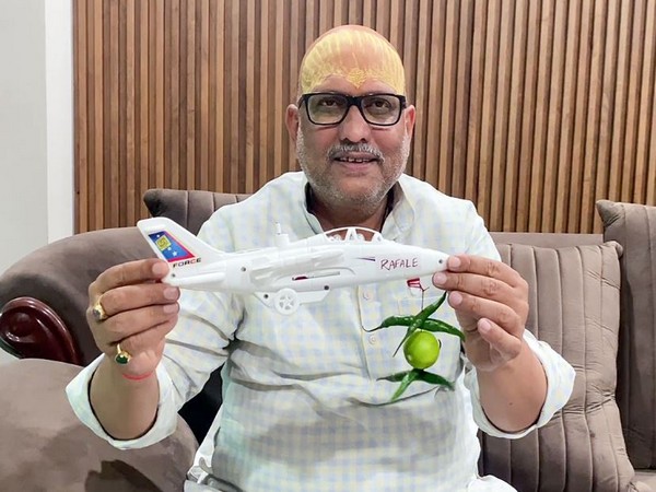 Ajay Rai shows a 'toy plane' with Rafale written on it and lemon-chillies hanging in it (Photo/ANI)