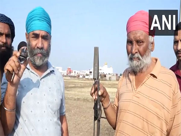 Locals with damaged drone parts (Photo/ ANI)