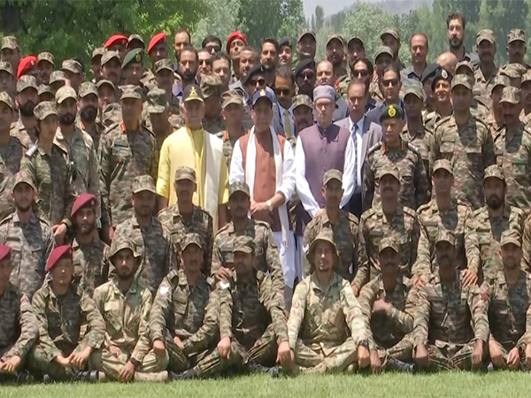 Defence Minister Rajnath Singh along with  J-K Lt Governor Manoj Sinha and Chief Minister Omar Abdullah with the soldiers. (Photo/ANI)