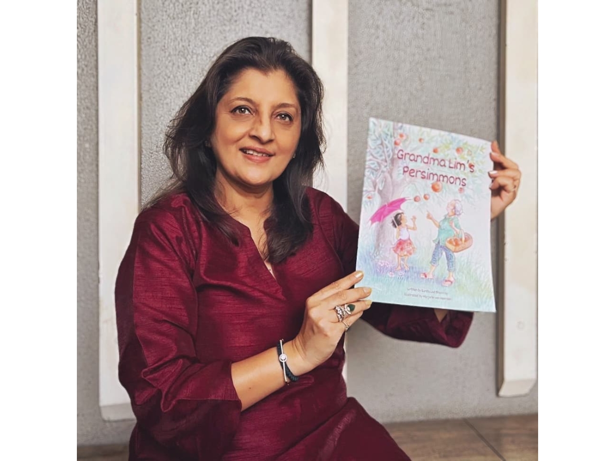 Sunita Bhamray with her latest book, Grandma Lim's Persimmons