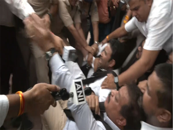 Congress leader being detained by the police (Photo/ANI)