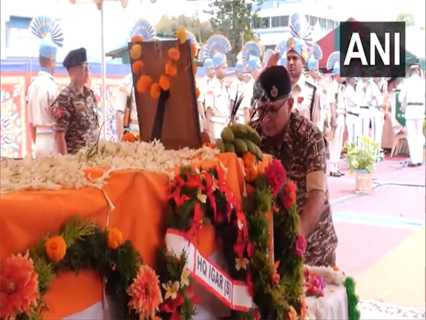 Family members and friends pay last respects to CRPF officer Maharabam Prabo Singh in Imphal (Photo/ANI)